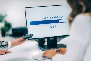 Data recovery specialist performing data transfer from an old computer to a new system in Denver Metro area.