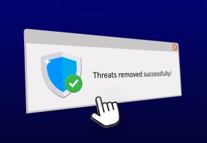 A notification pop-up indicating successful virus removal with a shield icon.