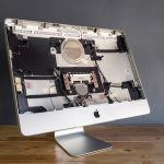 Disassembled Apple iMac computer showing internal components for repair and upgrades