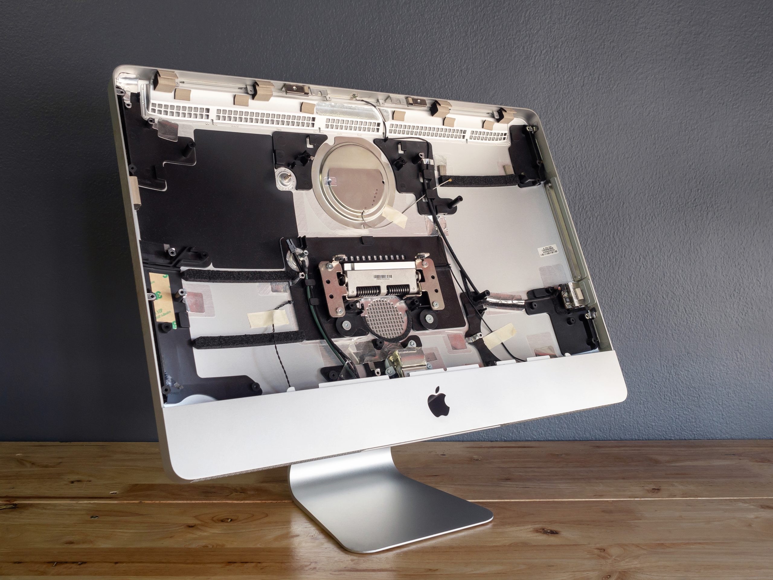 Disassembled Apple iMac computer showing internal components for repair and upgrades