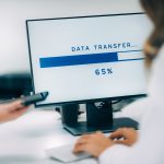 Data recovery specialist performing data transfer from an old computer to a new system in Denver Metro area.