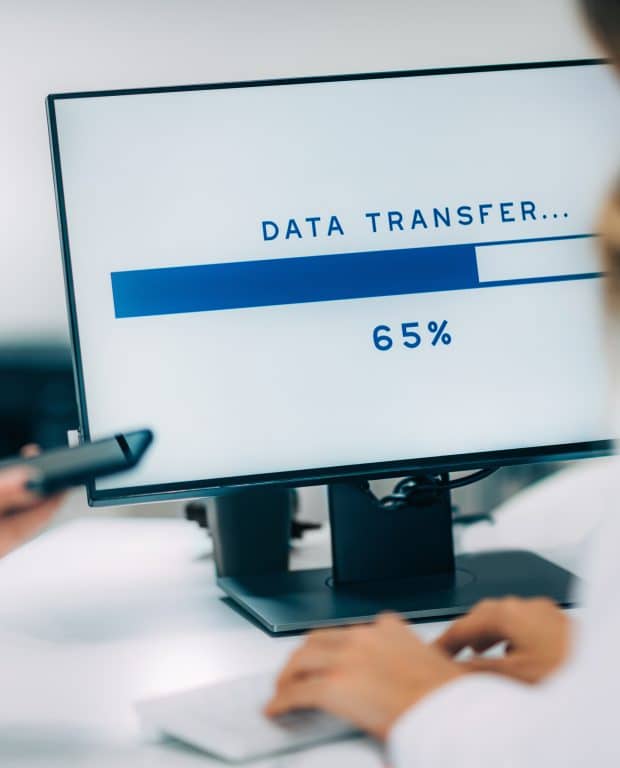 Data recovery specialist performing data transfer from an old computer to a new system in Denver Metro area.