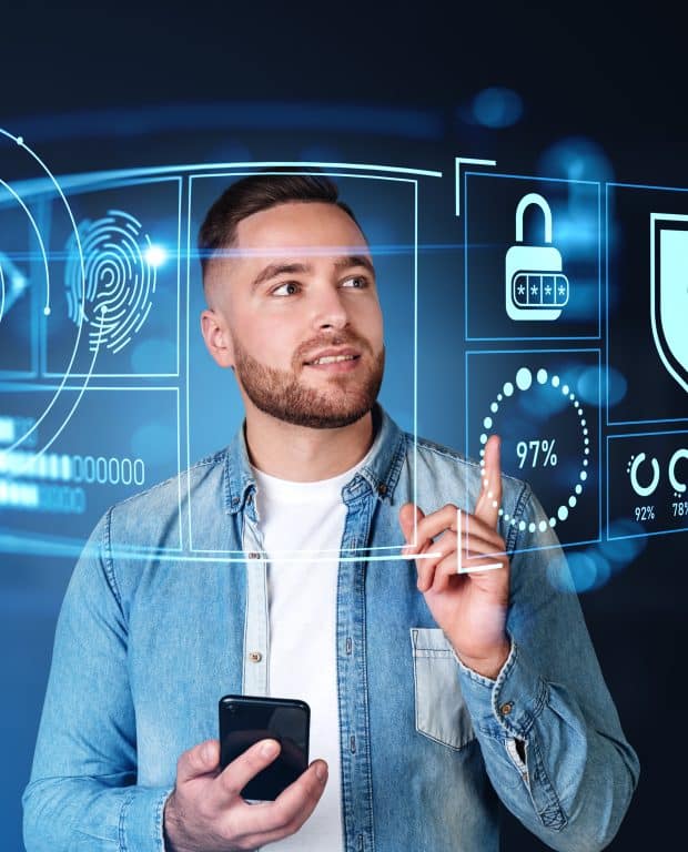 Man using futuristic digital interfaces with cybersecurity icons such as fingerprint, lock, and shield, symbolizing advanced protection of personal data.
