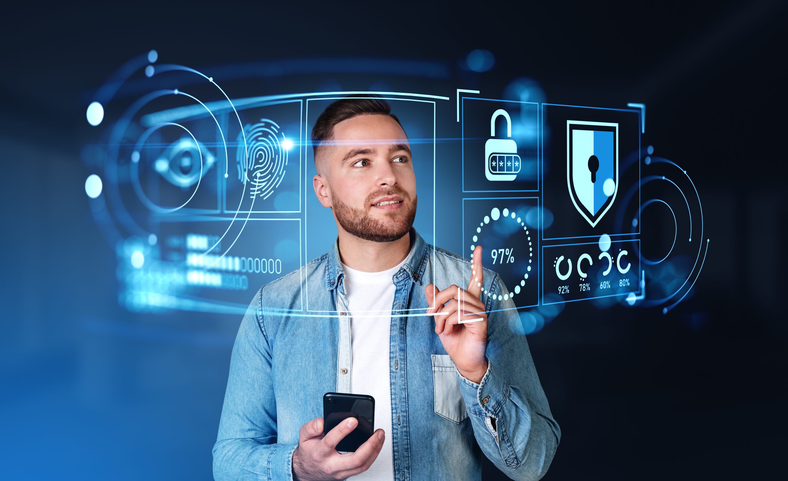Advanced Cybersecurity Solutions for Personal and Business Data Man using futuristic digital interfaces with cybersecurity icons such as fingerprint, lock, and shield, symbolizing advanced protection of personal data.