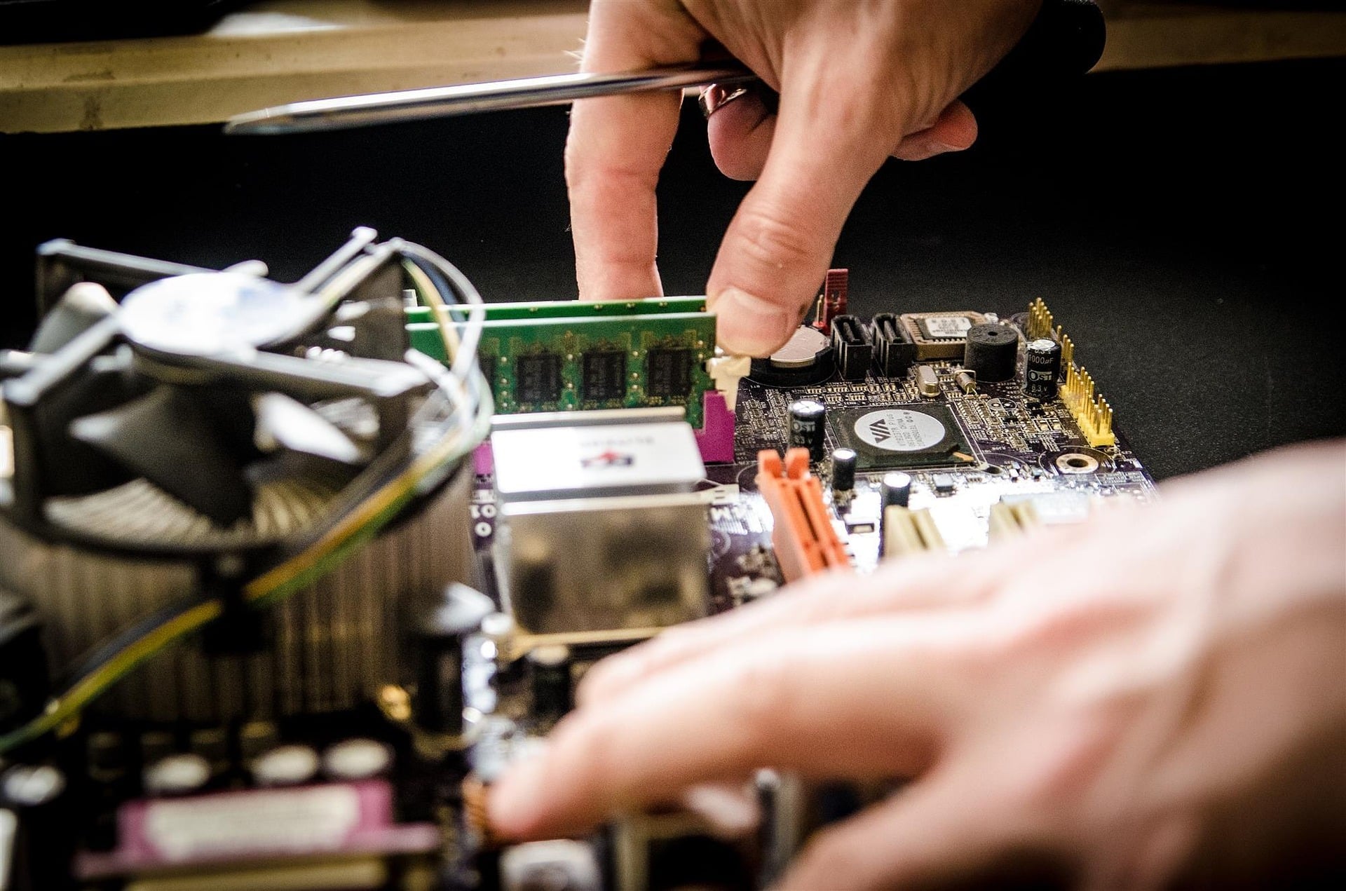 Computer Repair Aurora CO – RAM Installation and Motherboard Repair Technician installing RAM during computer repair service in Aurora Colorado